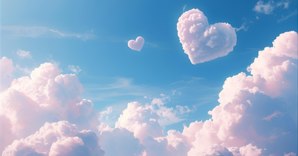 青空にハート型の雲が浮かぶ風景。恋の願いを占いで叶えたいイメージ